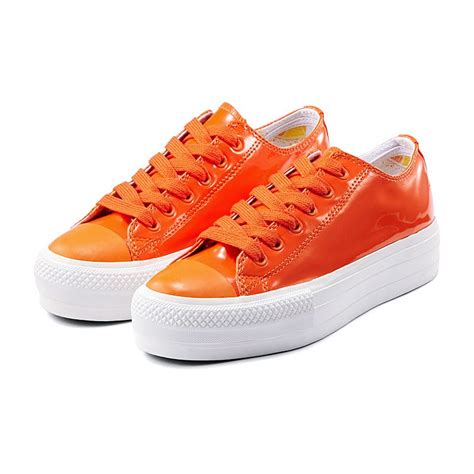 orange platform sneakers.